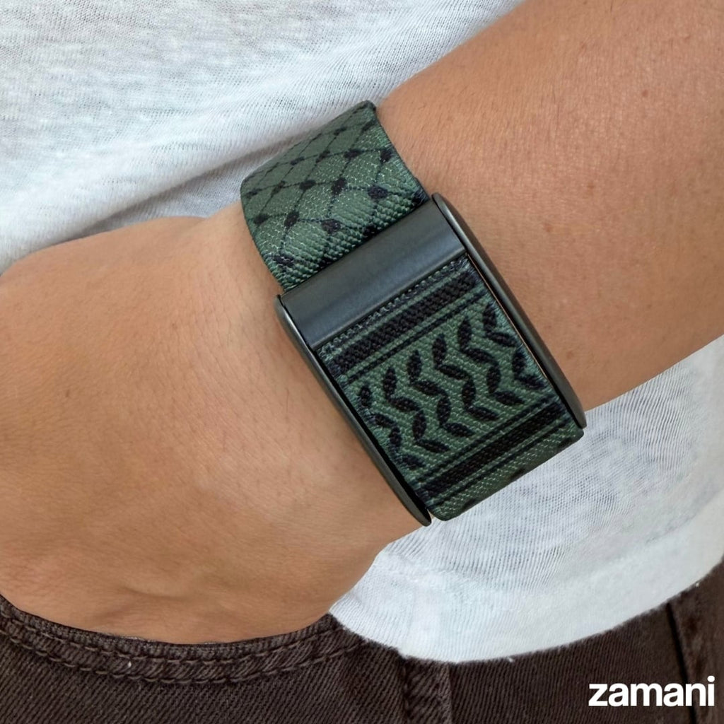 Olive green Keffiyeh WHOOP band worn on the wrist
